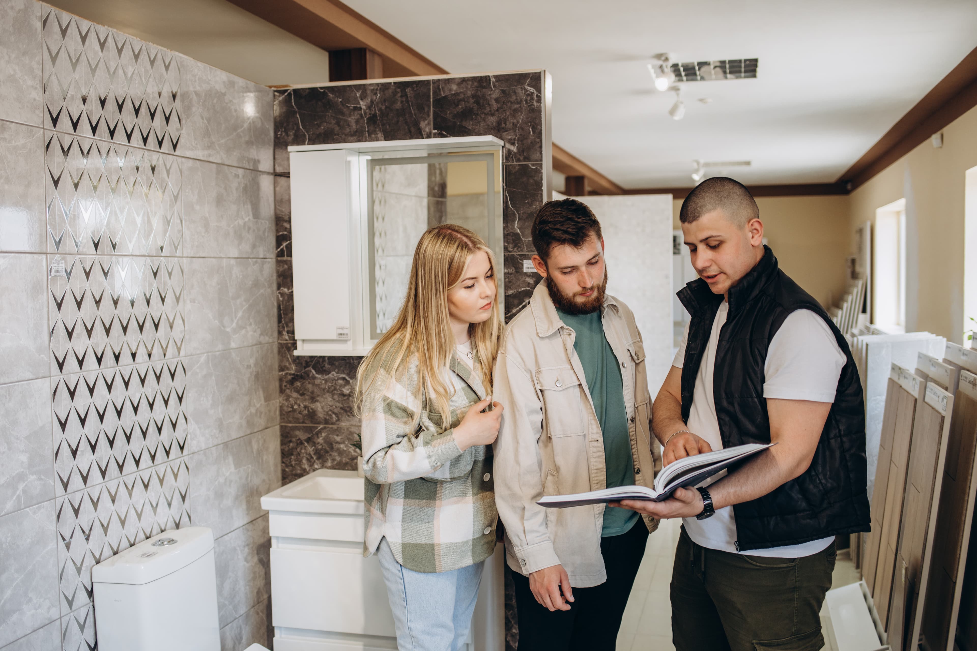 couple looking tiled bathroom